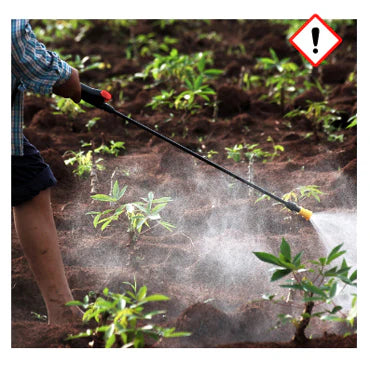 A barefoot human watering crops