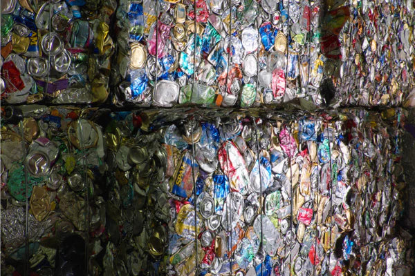 Image of recycled plastics in bails that are stacked on top of each other.