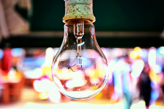 A closeup photo of a light bulb. The light is turned off.